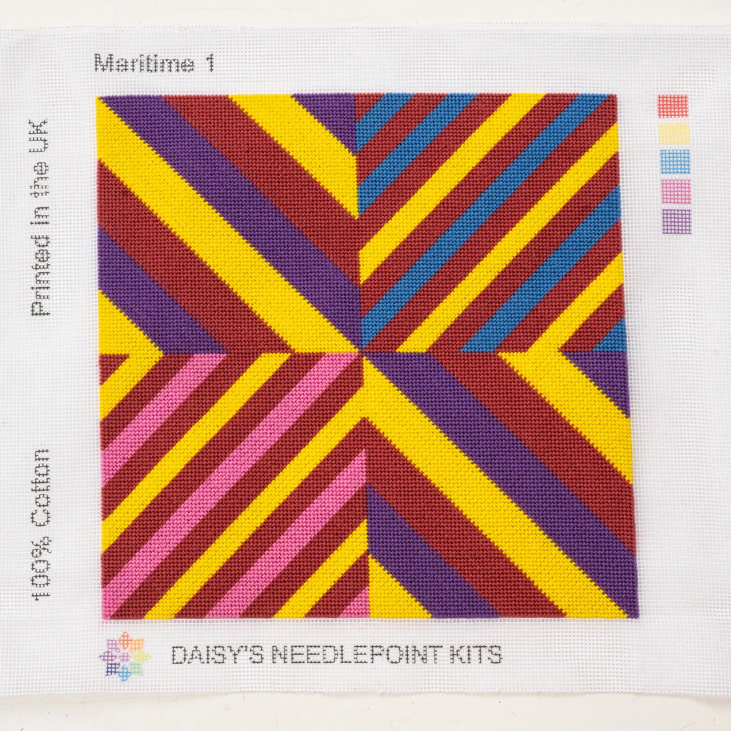 A colorful geometric patterned needlepointed kit. Designed and sold by Daisy’s Needlepoint Kits.
