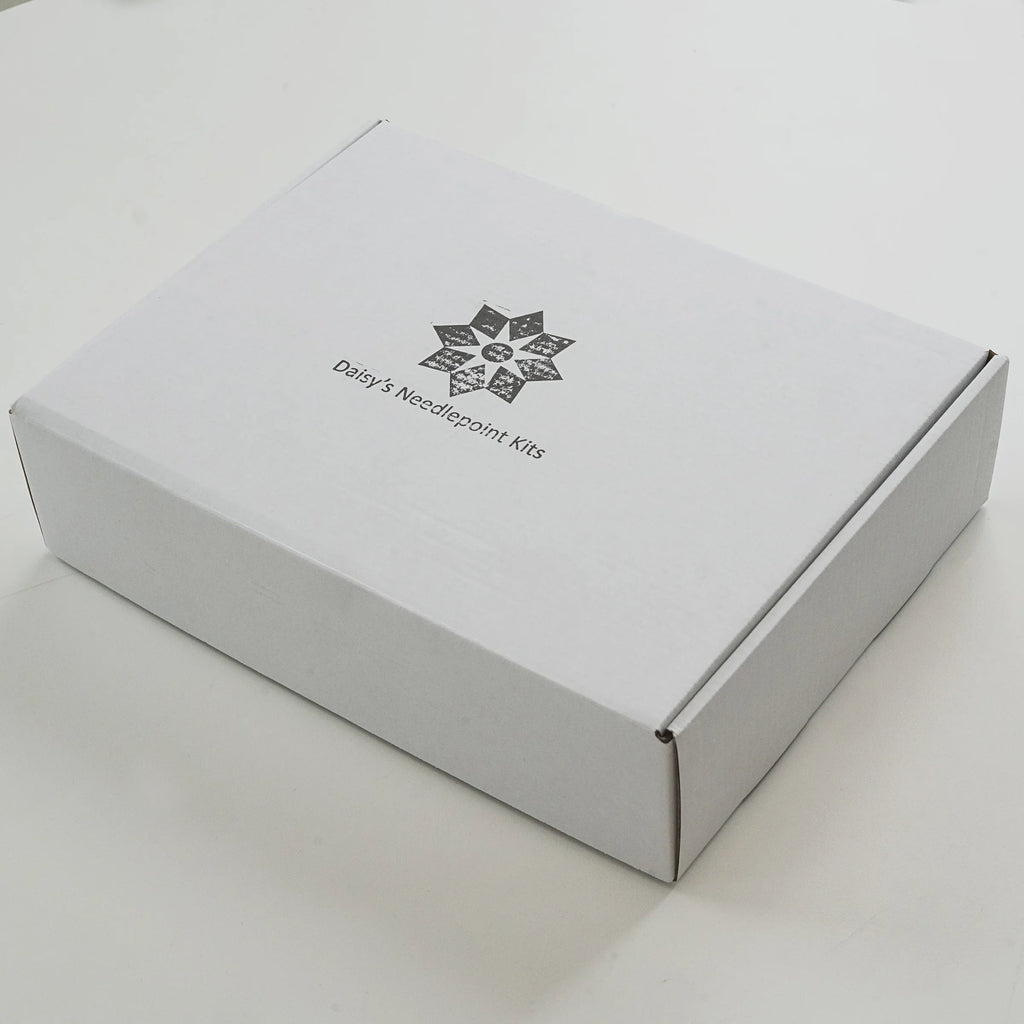 White box with 'Daisy's Needlepoint Kits' logo on a light gray background