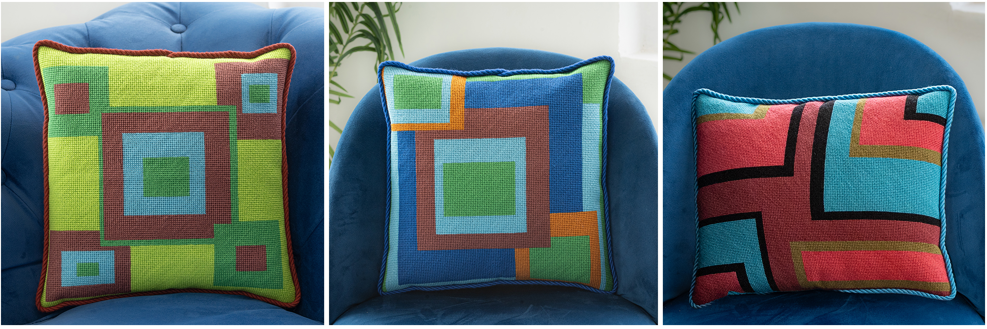 Three colorful geometric patterned needlepointed cushion on a blue couch. Designed and sold by Daisy’s Needlepoint Kits.
