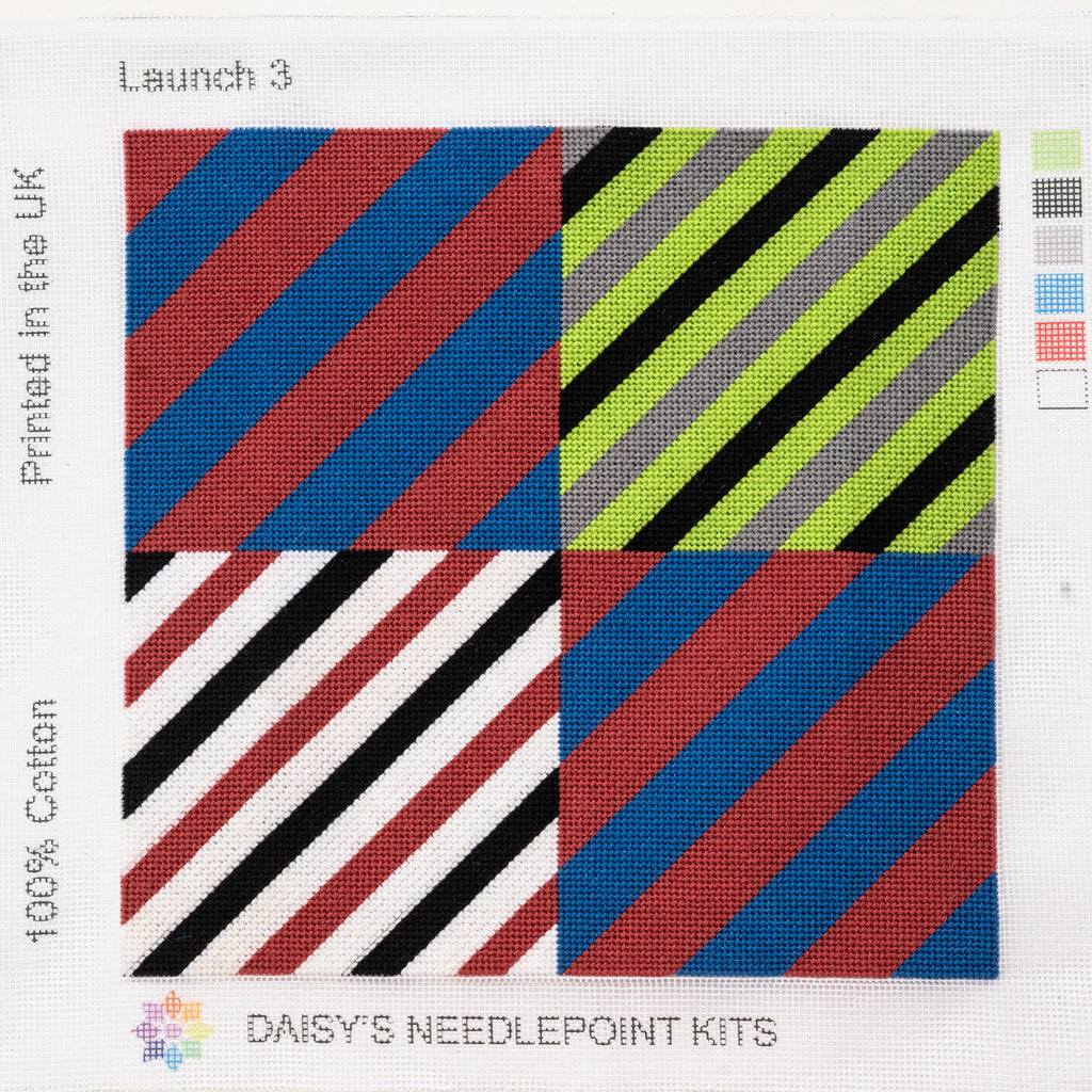 A colorful geometric patterned needlepointed kit. Designed and sold by Daisy’s Needlepoint Kits.